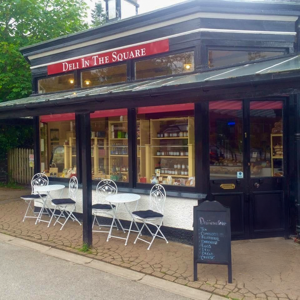 Deli in the Square in Strathpeffer, with outdoor café seating outside the shopfront.