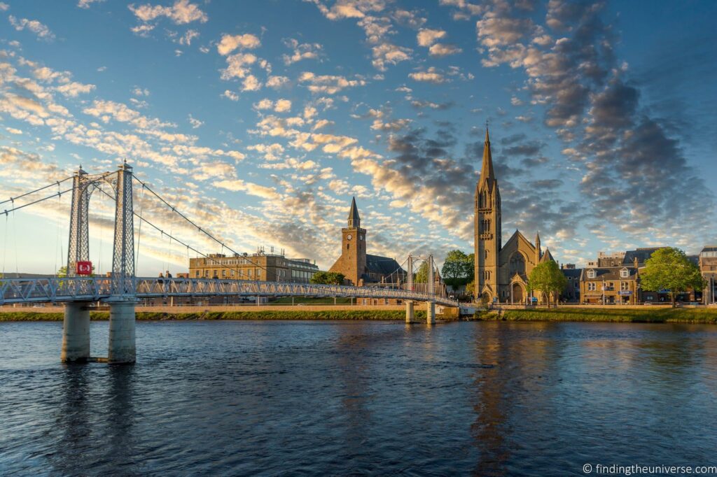 View across the River Ness to the Greig Street suspension bridge and the Free Church of Scotland on Bank Street in Inverness.