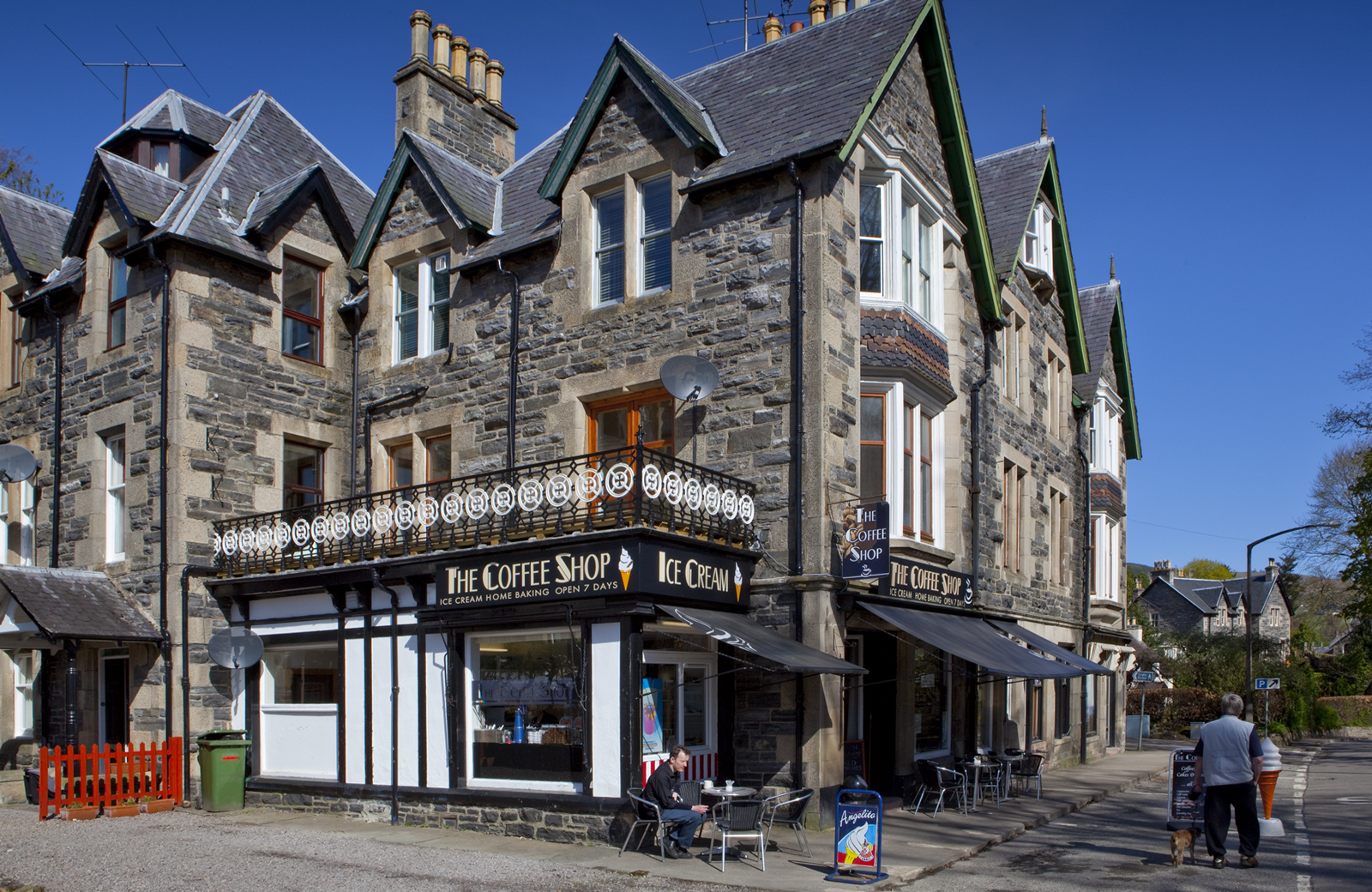 Cromartie Buildings in Strathpeffer, a historic stone building with The Coffee Shop on the ground floor.